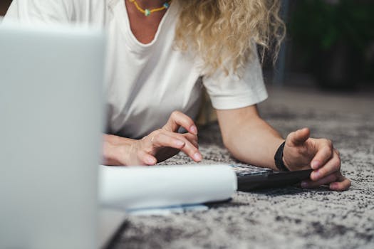 freelancer managing budget on laptop