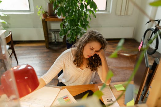 freelancer organizing their workspace with documents