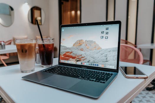 freelance work setup with coffee and laptop