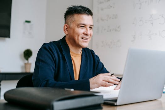 happy freelancer working on a laptop