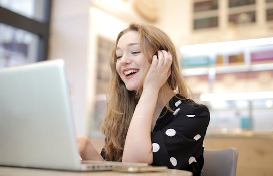 happy freelancer working on a laptop