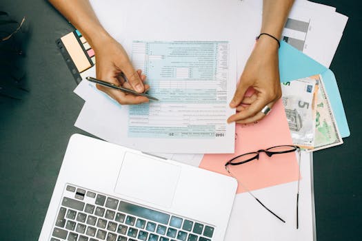 calculator and financial documents on desk