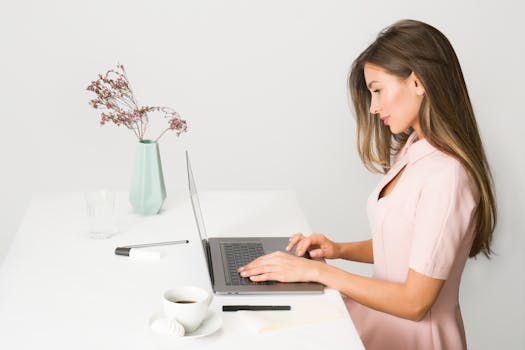 freelancer at a desk with a laptop and coffee