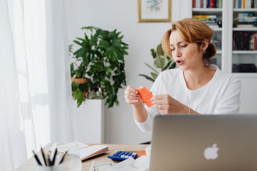 freelancer checking finances on laptop