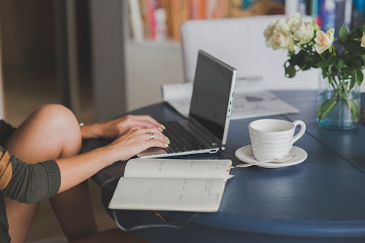 freelancer working at a desk with a laptop