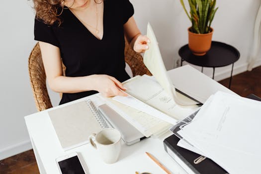 A freelancer organizing receipts and documents