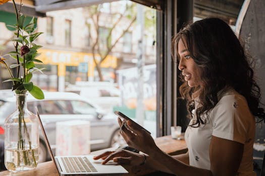 a freelancer working on a laptop in a cafe