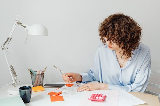 Image of a person organizing expense receipts